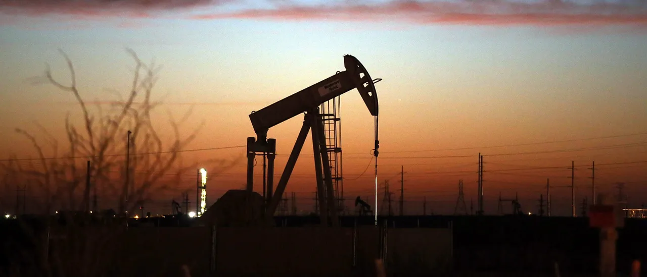 ANDREWS, TX - JANUARY 20: An oil pumpjack works at dawn in the Permian Basin oil field on January 20, 2016 in the oil town of Andrews, Texas. Despite recent drops in the price of oil, many residents of Andrews, and similar towns across the Permian, are trying to take the long view and stay optimistic. The Dow Jones industrial average plunged 540 points on Wednesday after crude oil plummeted another 7% and crashed below $27 a barrel. (Photo by Spencer Platt/Getty Images)
