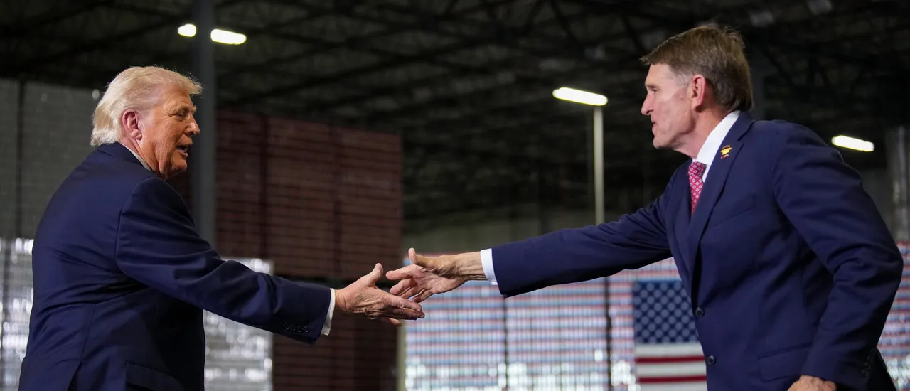 HEBRON, KENTUCKY - MARCH 11: U.S. President Donald Trump (L) shakes hands with Republican congressional candidate for Kentucky, Ed Gallrein as they speak on stage at Verst Logistics on March 11, 2026 in Hebron, Kentucky. Verst Logistics handles packaging, shrink sleeve labeling, and transportation management for various brands. (Photo by Andrew Harnik/Getty Images)