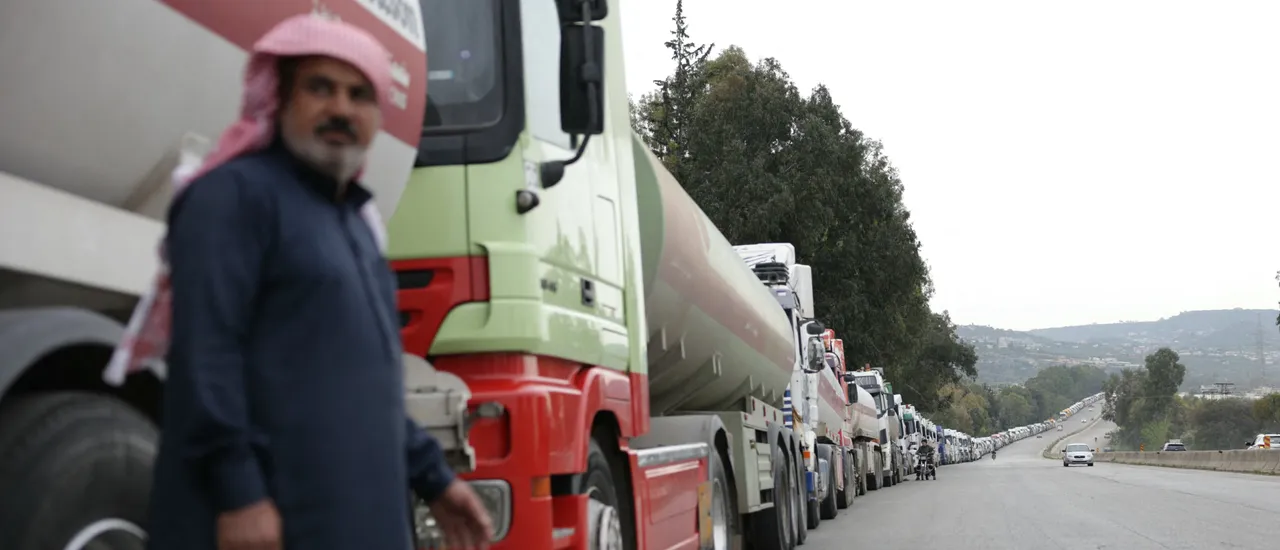 A long convoys of Iraqi diesel-laden tanker trucks line up along the highway Tartus-Baniyas highway as they wait to unload their cargo at the Baniyas port refinery on the Mediterranean Sea, on April 15, 2026.(Photo by Bakr ALkasem / AFP via Getty Images)