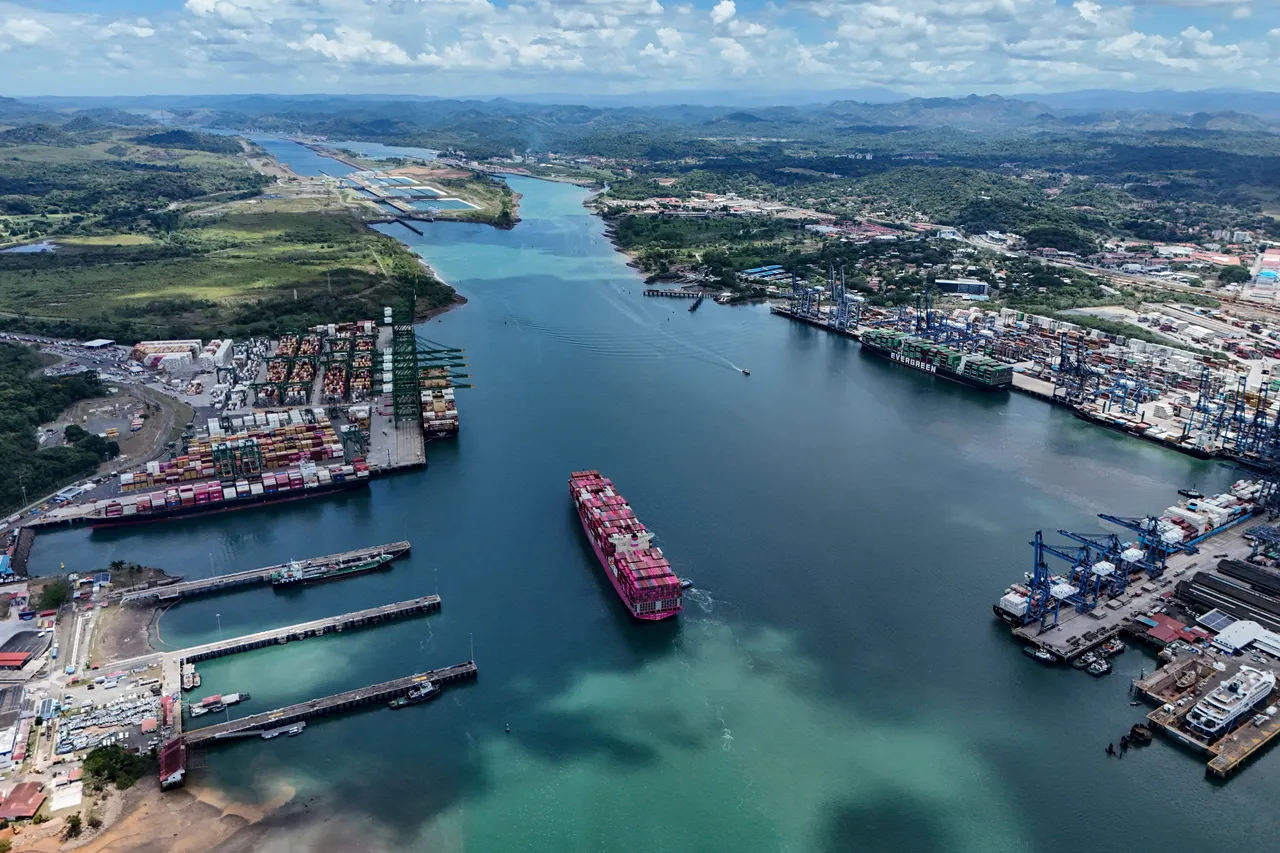 Aerial view of the One Contribution container ship sailing under the Tokio flag as it enters the Panama Canal in Panama City on April 21, 2026. According to the Panama Canal Authority, transit through the canal has increased due to the war in the Middle East. (Photo by MARTIN BERNETTI / AFP via Getty Images)