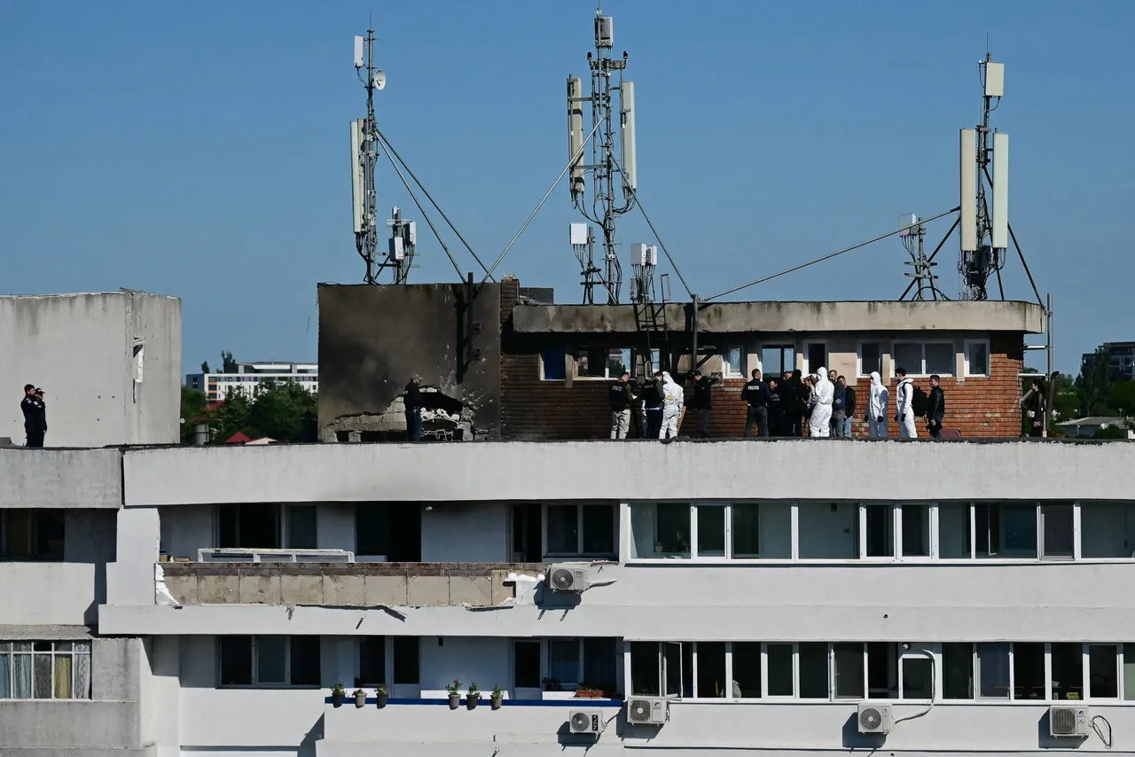 Police and forensic investigators stand on the rooftop as they examine the location of impact (L) over a damaged apartment after a Russian drone struck an apartment building in Galati, eastern Romania. A Russian drone wounded two people as it struck an apartment building in NATO-member Romania, its defence ministry said on May 29, 2026, the latest spillover from the four-year war into neighbouring states. (Photo by Daniel MIHAILESCU / AFP via Getty Images)