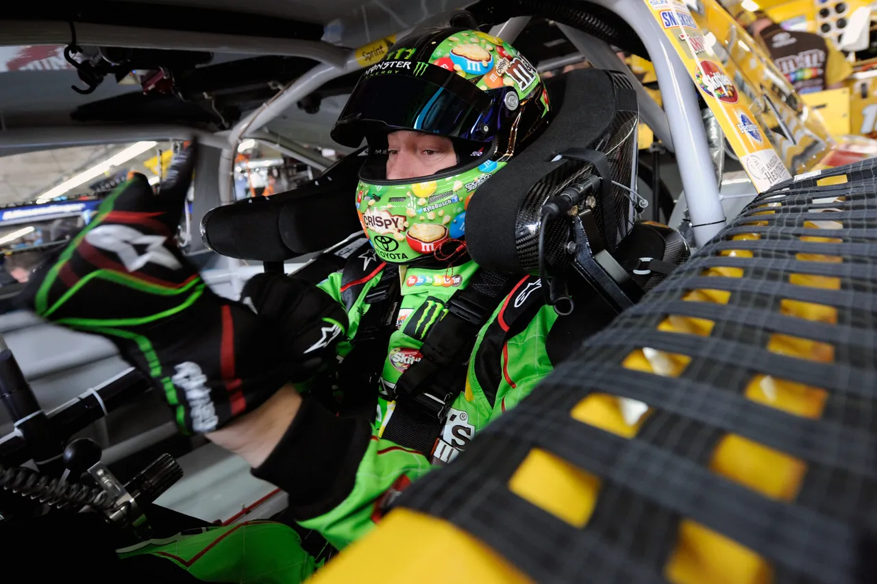 CHARLOTTE, NC - MAY 15: Kyle Busch, driver of the #18 M&M's Red Nose Day Toyota, sits in his car during practice for the NASCAR Sprint Cup Series All-Star Race at Charlotte Motor Speedway on May 15, 2015 in Charlotte, North Carolina. (Photo by Jared C. Tilton/Getty Images)