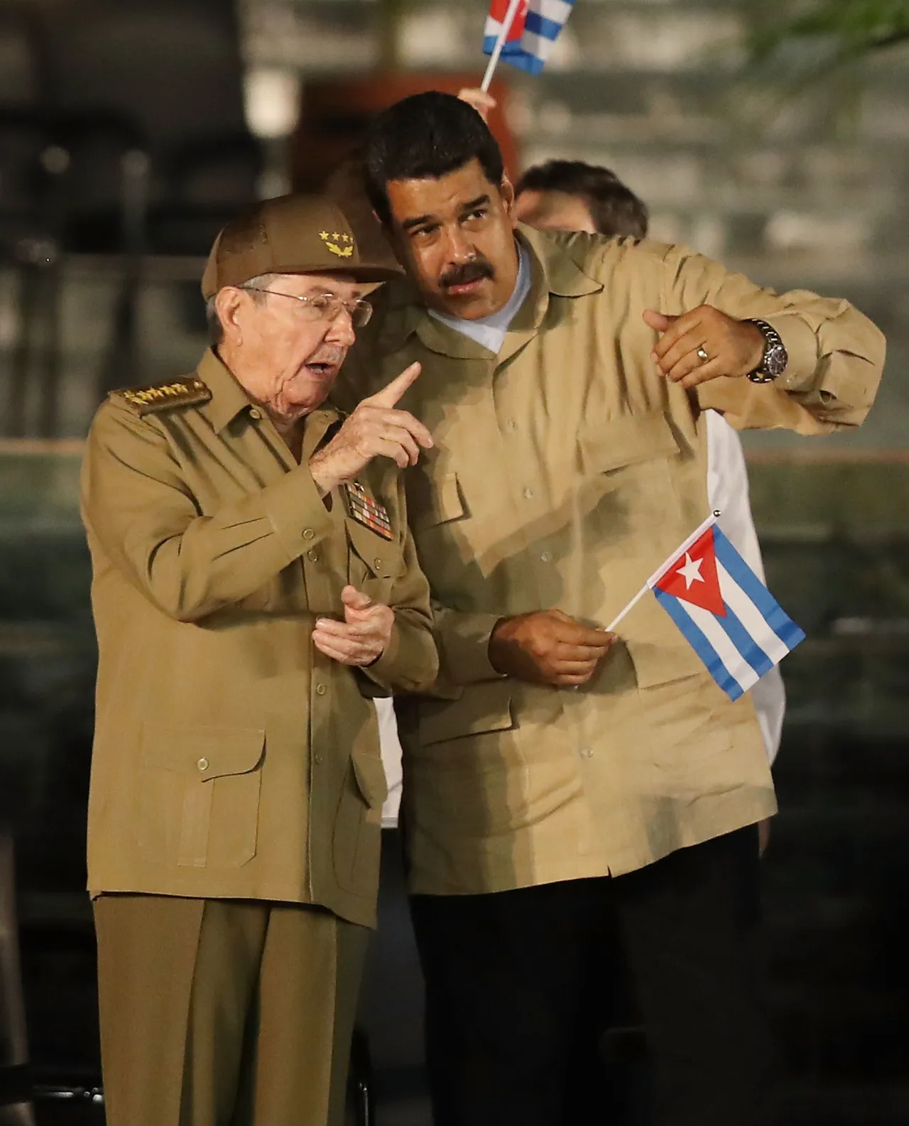 Cuban President Raul Castro speaks with Venezuela's President Nicolas Maduro during a memorial tribute for his brother former President of Cuba Fidel Castro at the Antonio Maceo Revoloution Square before his burial tomorow on December 3, 2016 in Santiago de Cuba, Cuba. (Photo by Joe Raedle/Getty Images)