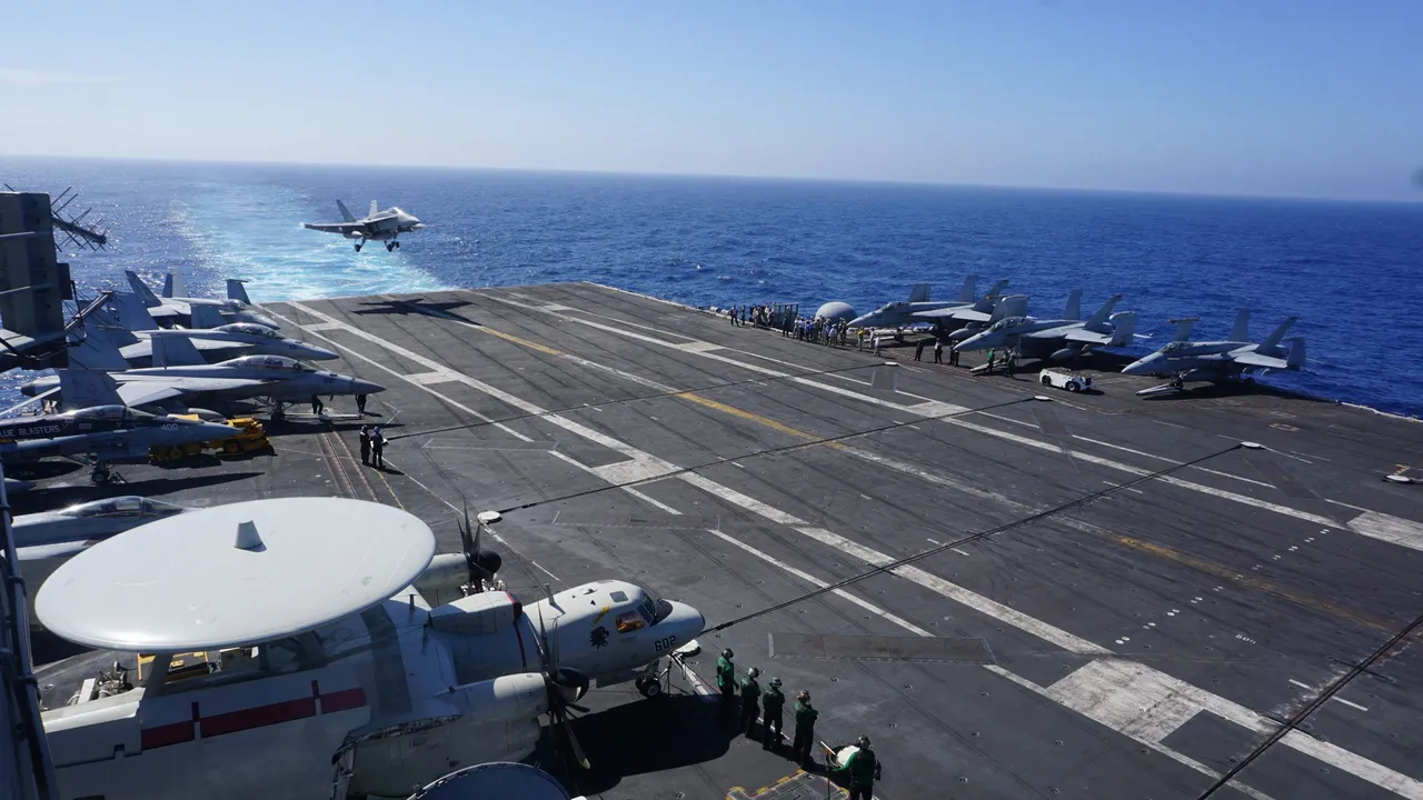 An F-18 Hornet fighter jet prepares to land on the flight deck of the aircraft carrier USS Carl Vinson on February 14, 2018, as the carrier strike group takes part in a routine deployment mission in the South China Sea, one hour away from Manila. (AYEE MACARAIG/AFP via Getty Images)