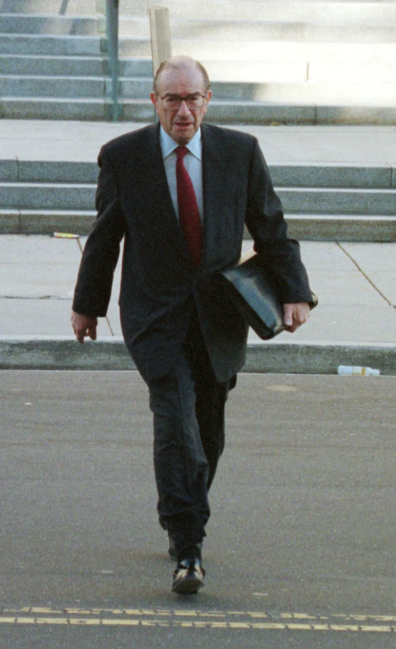 Federal Reserve Board Chairman Alan Greenspan arrives at the Federal reserve building, November 16,1999. The Federal Reserve Board is debating whether the buoyant U.S. economy needs another small increase in key interest rates this year to keep inflation at bay. (photo by Mark Wilson)
