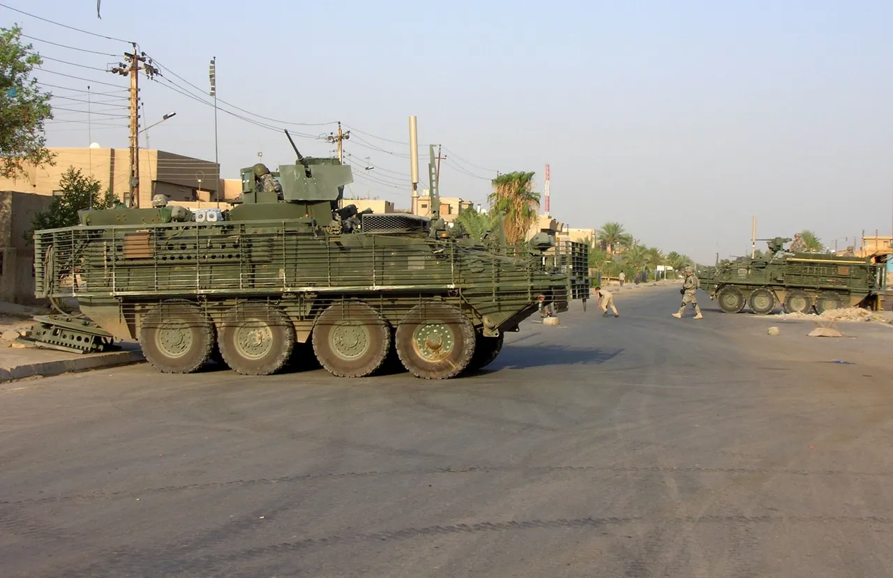 US soldiers escorted by Stryker armored vehicles patrol a street in Baghdad's Ghazaliya neighborhood Aug. 15, 2006, where the military's Bravo Company 23rd infantry regiment 2nd division conducts house to house search for illegal weapons, as part of the new security plan for the war torn capital. (THIBAULD MALTERRE/AFP via Getty Images)