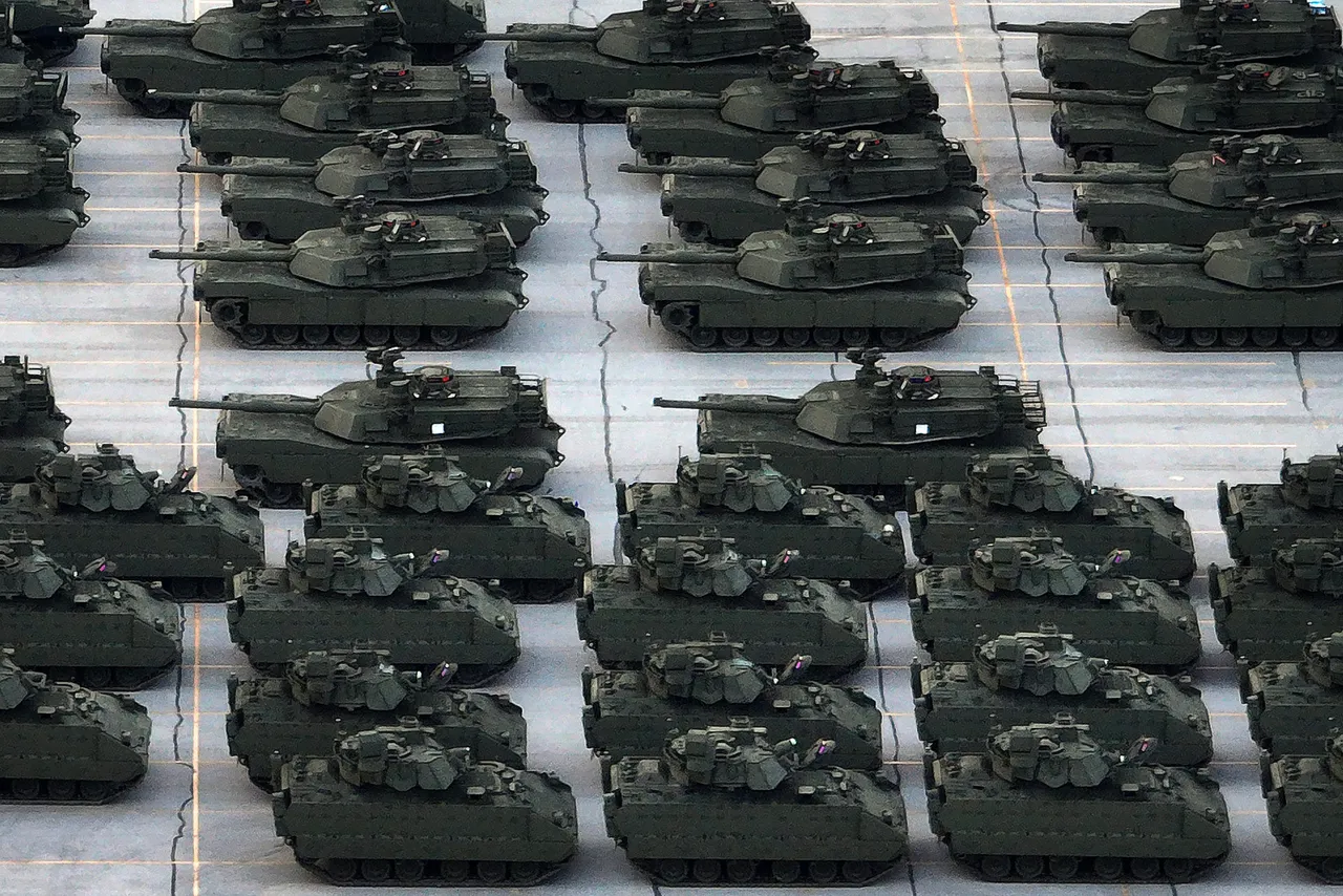 In an aerial view, U.S. Army vehicles, including M1 Abrams tanks and Bradley FIghting Vehicles, are are loaded onto tractor trailer trucks in the CSX rail yard on June 09, 2025 in Jessup, Maryland. (Photo by Chip Somodevilla/Getty Images)