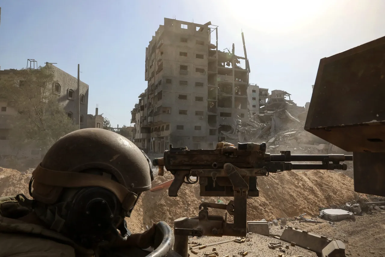 This picture taken during a media tour organised by the Israeli army on October 3, 2025, shows an Israeli army soldier behind a mounted machine gun in the vicinity of the Jordanian Field Hospital in Gaza City. (Photo by JACK GUEZ/POOL/AFP via Getty Images)