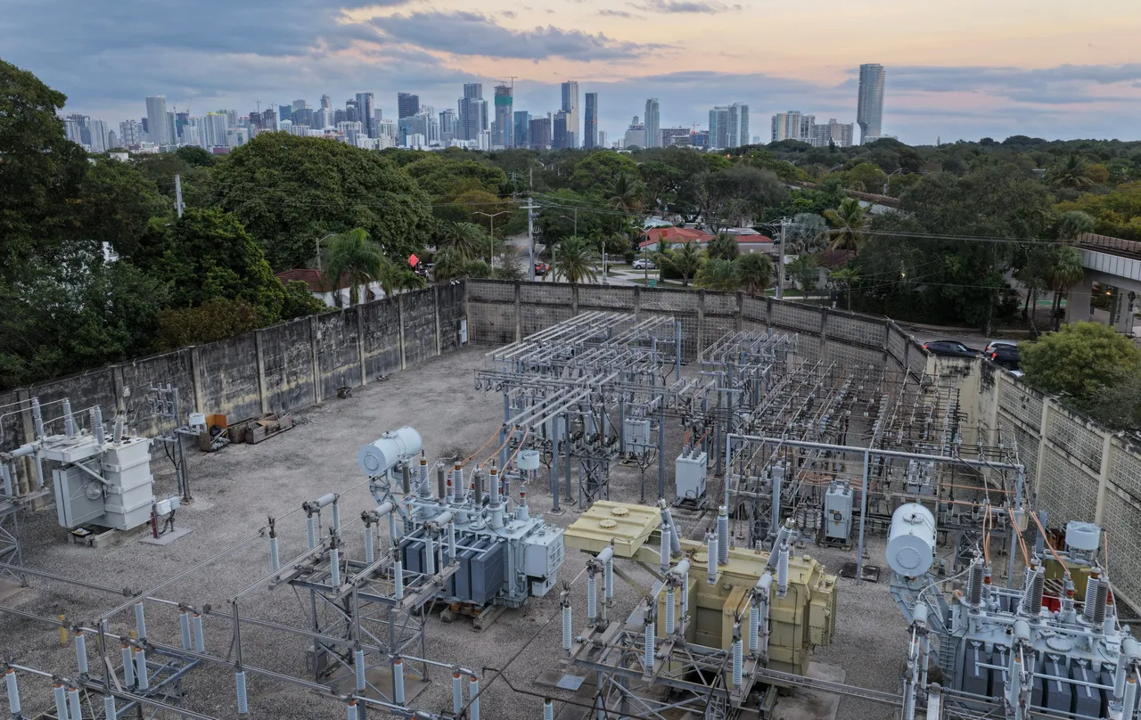 In an aerial view, high voltage power lines run through a sub-station along the electrical power grid on January 14, 2026 in Miami, Florida. (Photo by Joe Raedle/Getty Images)