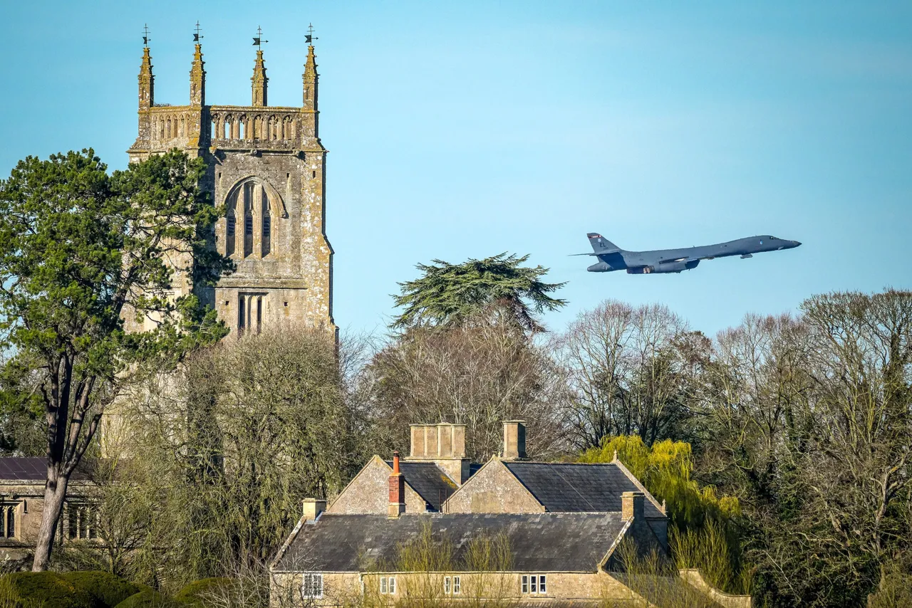 A USAF Rockwell B-1 Lancer bomber takes off on a sortie from RAF Fairford over the Cotswold village of Kempsford and the village church of St. Mary the Virgin on March 21, 2026 in Fairford, England. (Photo by Christopher Furlong/Getty Images)