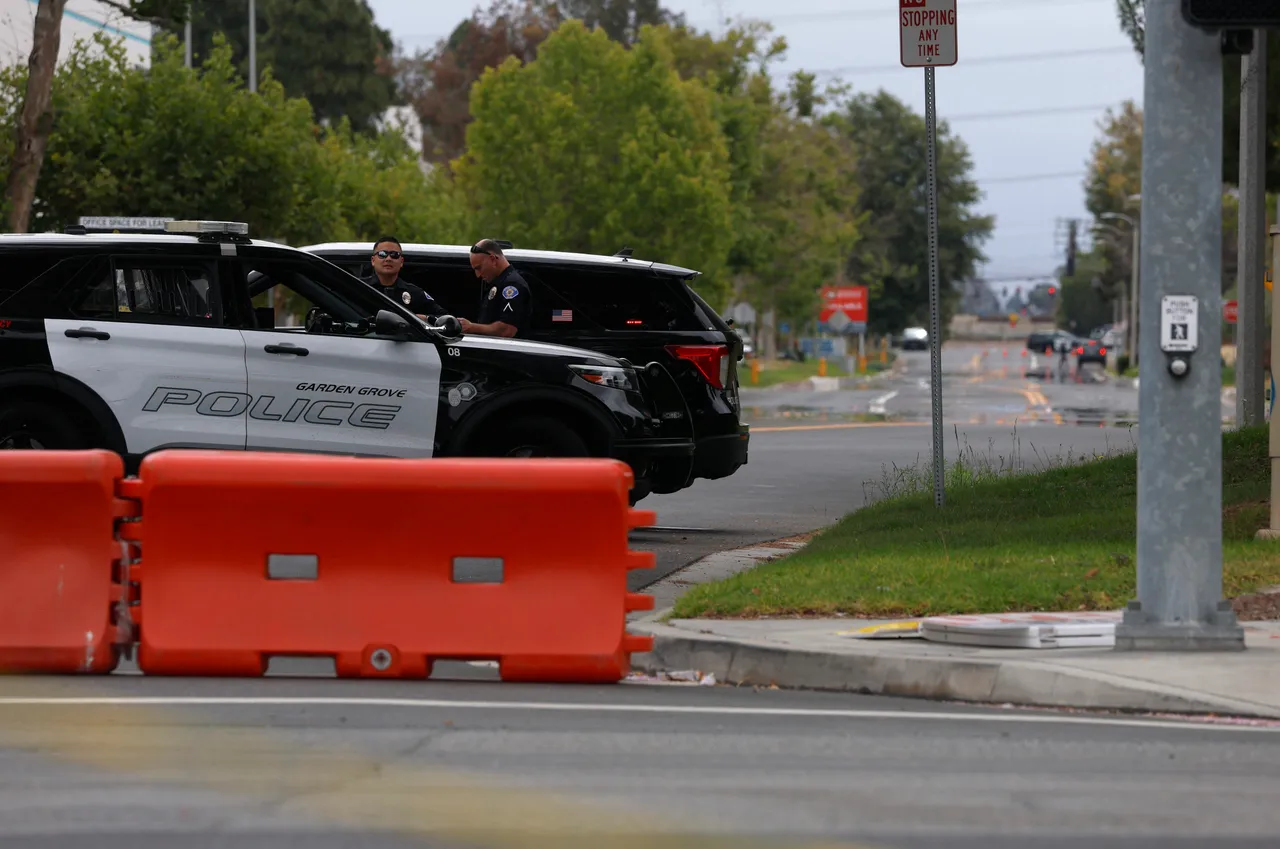 GARDEN GROVE, CALIFORNIA - MAY 26: Garden Grove police officers block Orangewood Avenue on May 26, 2026 in Garden Grove, California. (Photo by Justin Sullivan/Getty Images)