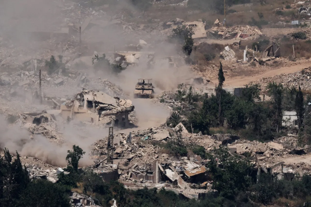 This picture taken from a position in the Upper Galilee in northern Israel, near the Israel-Lebanon border shows Israeli Merkava tanks driving along a road past destroyed buildings in southern Lebanon on June 17, 2026. (Photo by JACK GUEZ / AFP via Getty Images)