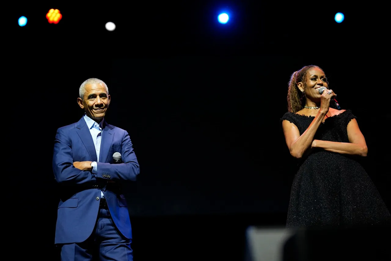 Former First Lady Michelle Obama and former President Barack Obama speak to administration and campaign alumni during a surprise visit ahead of the dedication ceremony for the Obama Presidential Center in Chicago, Illinois, on June 17, 2026. The grand opening ceremony for the center will be held on June 18 before the center opens to the public on June 19. (Photo by Pablo Martinez Monsivais / POOL / AFP via Getty Images)