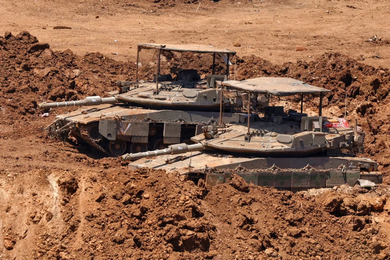 This picture taken from a position in the Upper Galilee in northern Israel shows Israeli tanks positioned along the border with southern Lebanon on June 22, 2026. (Photo by Jalaa MAREY / AFP via Getty Images)