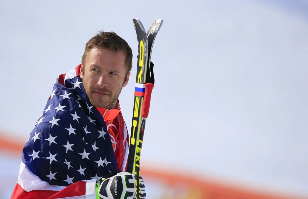 TOPSHOT - Bronze medallist US skier Bode Miller arrives on the podium during the Men's Alpine Skiing Super-G Flower Ceremony at the Rosa Khutor Alpine Center during the Sochi Winter Olympics on February 16, 2014. AFP PHOTO / ALEXANDER KLEIN (Photo by ALEXANDER KLEIN / AFP via Getty Images)