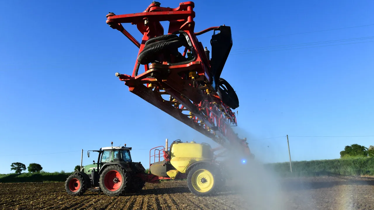 French farmer Nicolas Denieul sprays Roundup 720 glyphosate herbicide produced by US agrochemical giant Monsanto on May 11, 2018, on a field of no-till corn in Piace, northwestern France. (Photo by JEAN-FRANCOIS MONIER/AFP via Getty Images)