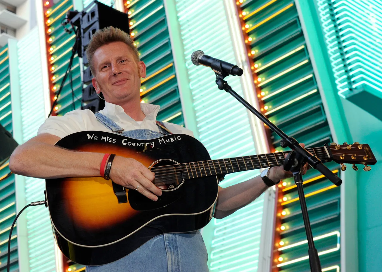 LAS VEGAS - APRIL 17: Recording artist Rory Feek of the duo Joey + Rory performs during the Academy of Country Music all-star concert at the Fremont Street Experience April 17, 2010 in Las Vegas, Nevada. (Photo by Ethan Miller/Getty Images)
