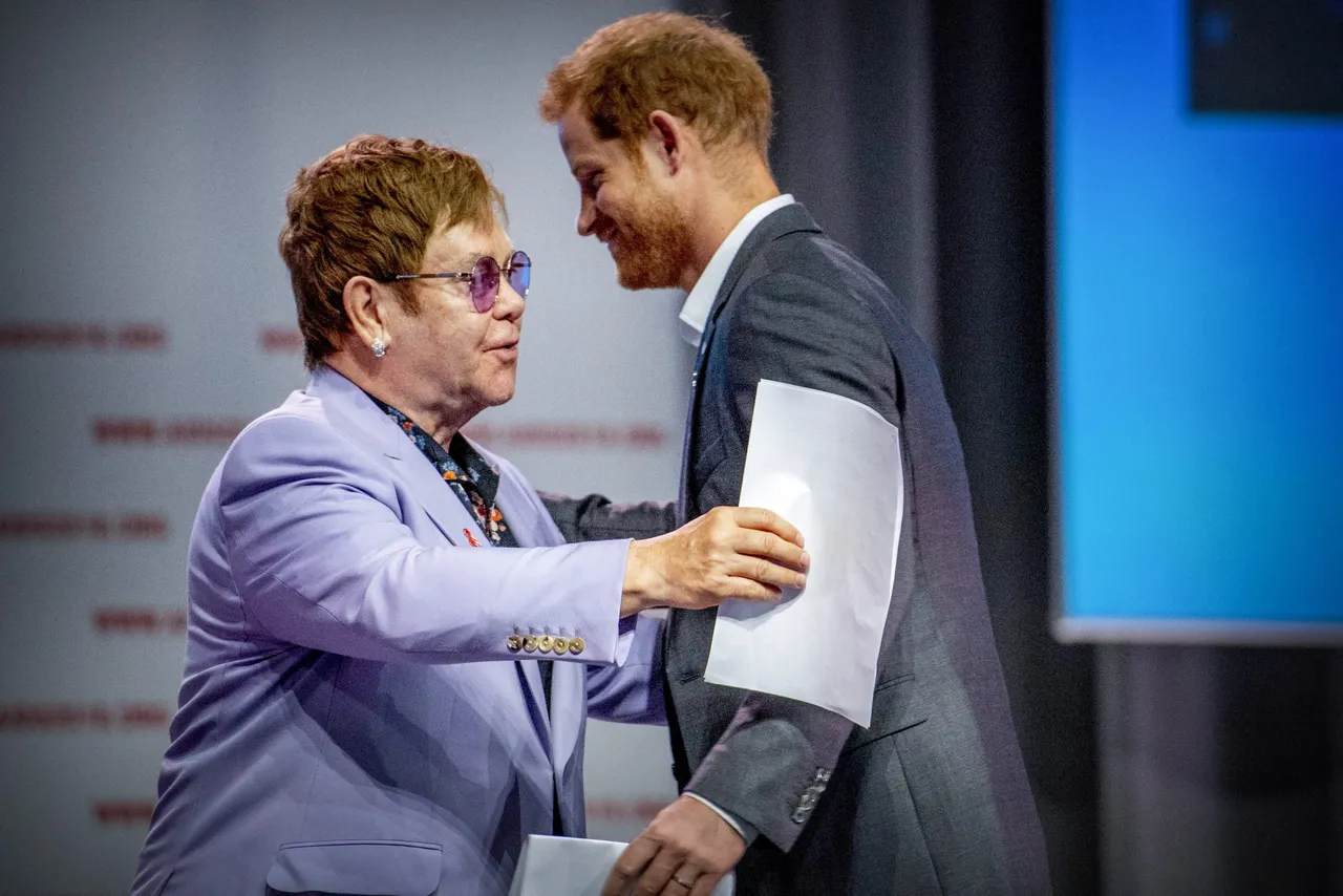 British Prince Harry (L) and sir Elton John attend a session about the Elton John Aids Fund on the second day of the Aids2018 conference, in Amsterdam on July 24, 2018. (Photo by Robin Utrecht / ANP / AFP via Getty Images) / Netherlands OUT