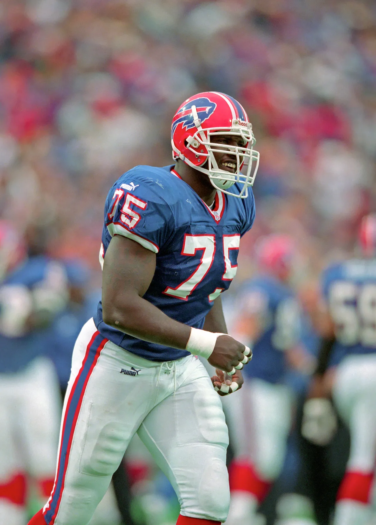 ORCHARD PARK, NY - OCTOBER 17: Defensive lineman Marcellus Wiley #75 of the Buffalo Bills looks on from the field during a game against the Oakland Raiders at Ralph Wilson Stadium on October 17, 1999 in Orchard Park, New York. The Raiders defeated the Bills 20-14. (Photo by George Gojkovich/Getty Images)