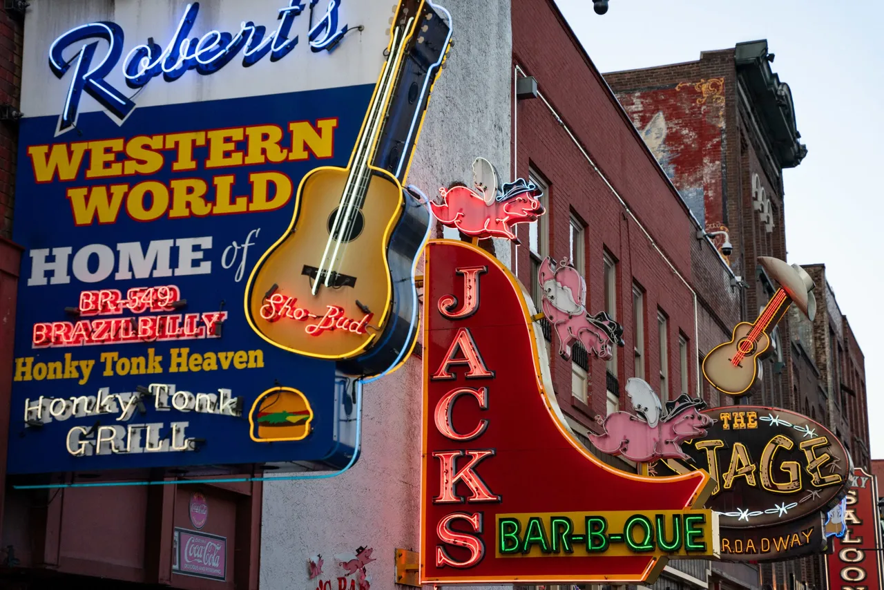 Neon signs on Broadway in downtown Nashville, Tennessee, on March 13, 2024. (Photo by SETH HERALD/AFP via Getty Images)