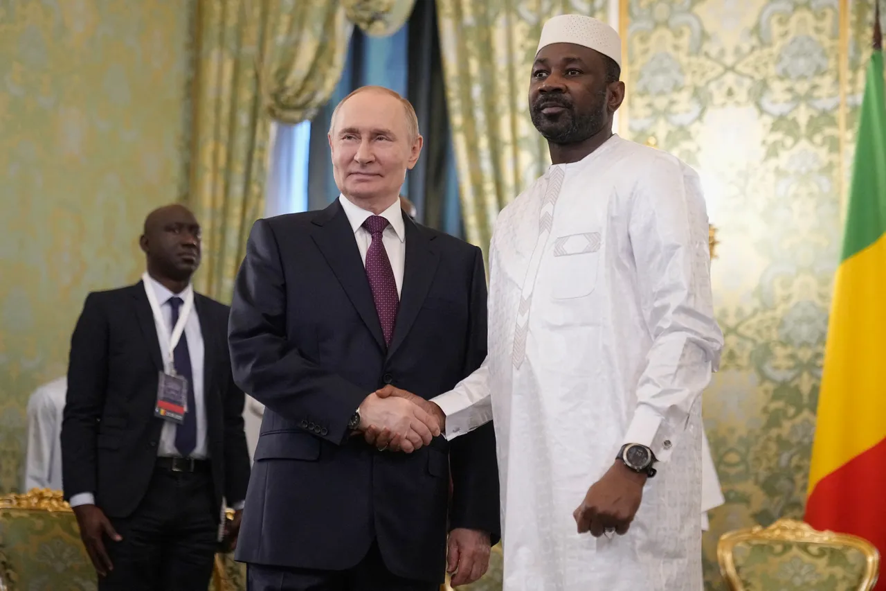 Russian President Vladimir Putin and Mali's junta leader Assimi Goita shake hands during a meeting at the Kremlin in Moscow on June 23, 2025 (Photo by PAVEL BEDNYAKOV/POOL/AFP via Getty Images)