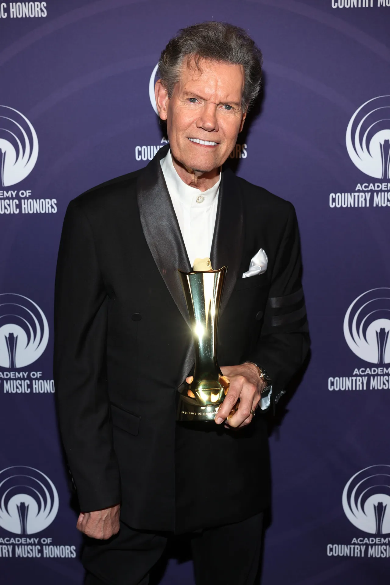 NASHVILLE, TENNESSEE - AUGUST 20: Randy Travis poses with the ACM Milestone Award during the 18th Academy Of Country Music Honors at The Pinnacle on August 20, 2025 in Nashville, Tennessee. (Photo by Terry Wyatt/Getty Images for ACM)