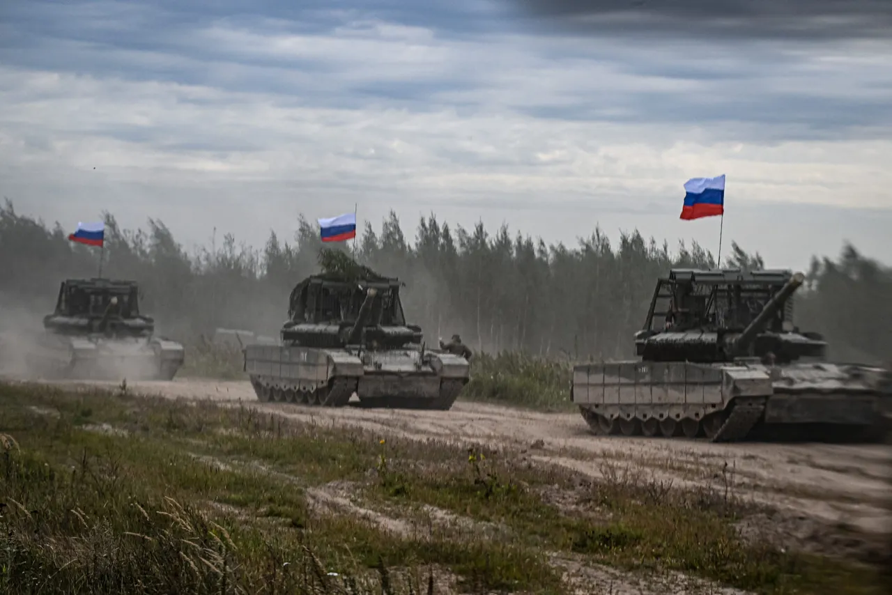 Russian tanks move during the "Zapad-2025" (West-2025) joint Russian-Belarusian military drills at a training ground near the town of Borisov, east of the capital Minsk, on September 15, 2025. (Photo by OLESYA KURPYAYEVA/AFP via Getty Images)