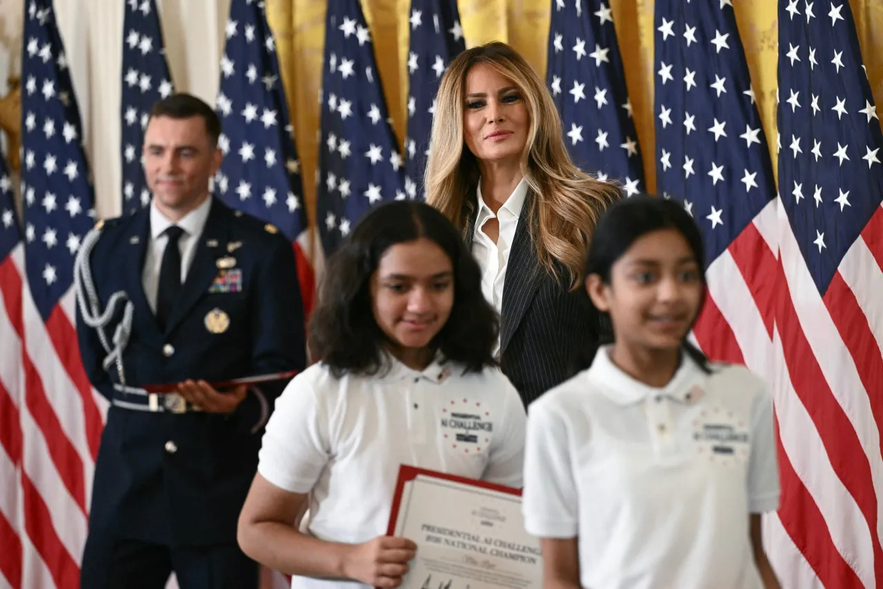 First Lady Melania Trump greets a group of students during the Presidential Artificial Intelligence Challenge National Champion Awards Ceremony in the East Room of the White House in Washington, DC on June 9, 2026. (Photo by Brendan SMIALOWSKI / AFP via Getty Images)