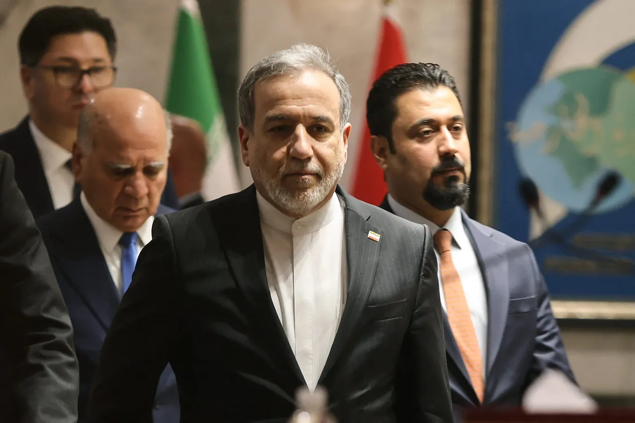 Iranian Foreign Minister Abbas Araghchi (C) followed by Iraqi Foreign Minister Fuad Hussein (L) arrive for a joint press conference following a meeting in Baghdad on June 28, 2026.(Photo by AHMAD AL-RUBAYE / AFP via Getty Images)
