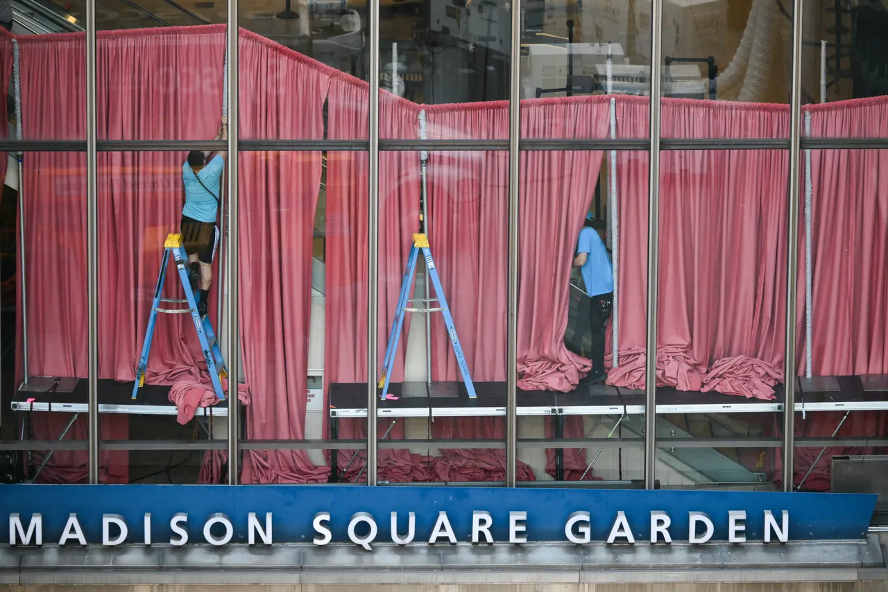 Workers adjust curtains inside Madison Square Garden, the reported venue for the wedding celebrations of pop singer Taylor Swift and pro-athlete Travis Kelce, in New York City on July 3, 2026. Swift and Kelce's official wedding plans are tightly under wraps, but New York is bracing to host the celebrity marriage of the year this week at Madison Square Garden. The wedding will reportedly take place Friday with a star-studded guest list of around 1,000, including models Gigi Hadid and Cara Delevingne, singer Selena Gomez, and actress Zoe Kravitz -- all known to be close Swift pals -- and Kelce's Kansas City Chiefs teammates. (Photo by ANGELA WEISS / AFP via Getty Images)