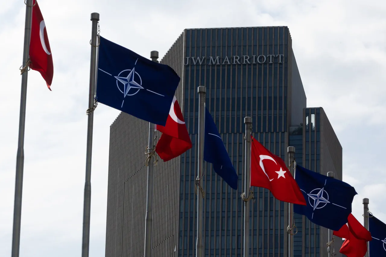 Turkish and NATO flags wave in front of the JW Marriott hotel where U.S. President Donald Trump is expected to stay during the 2026 NATO summit is seen on July 6, 2026 in Ankara, Turkey. Ankara is preparing to host the NATO Summit 2026 on July 7–8, bringing together leaders from all 32 member states, including the President of the United States. (Photo by Serdar Ozsoy/Getty Images)