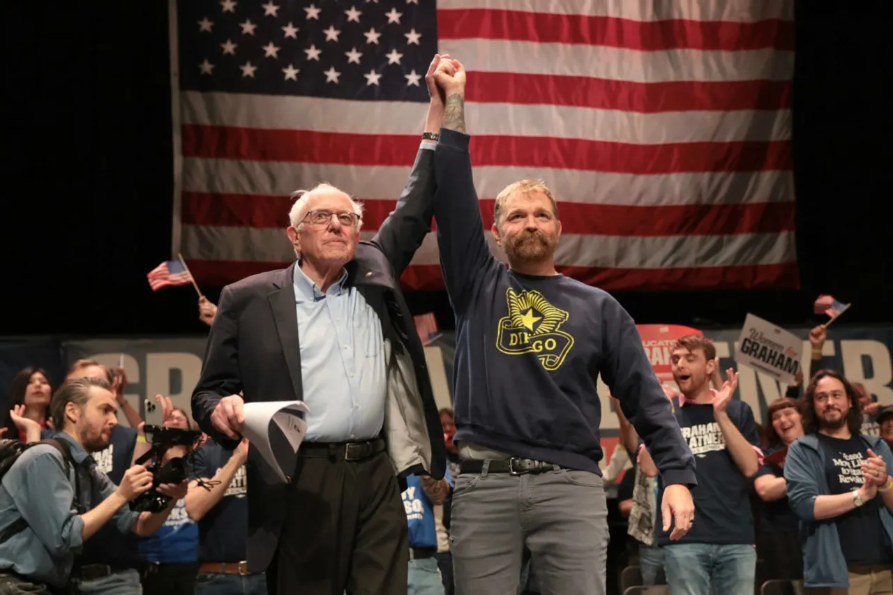 ORONO, MAINE - MAY 24: Sen. Bernie Sanders (I-VT) and Democratic U.S. Senate candidate Graham Platner stand together during a “Fighting Oligarchy” tour stop at the Collins Center for the Arts on the University of Maine campus on May 24, 2026 in Orono, Maine. Platner is the presumptive Democratic nominee and will face incumbent Sen. Susan Collins (R-ME) for Maine's U.S. Senate seat in the general election. (Photo by Joe Raedle/Getty Images)