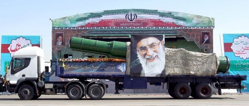 A military truck carrying a missile and a picture of Iran's Supreme Leader Ayatollah Ali Khamenei is seen during a parade marking the anniversary of the Iran-Iraq war (1980-88) in Tehran, in this September 22, 2015 file photo. REUTERS/Raheb Homavandi/TIMA