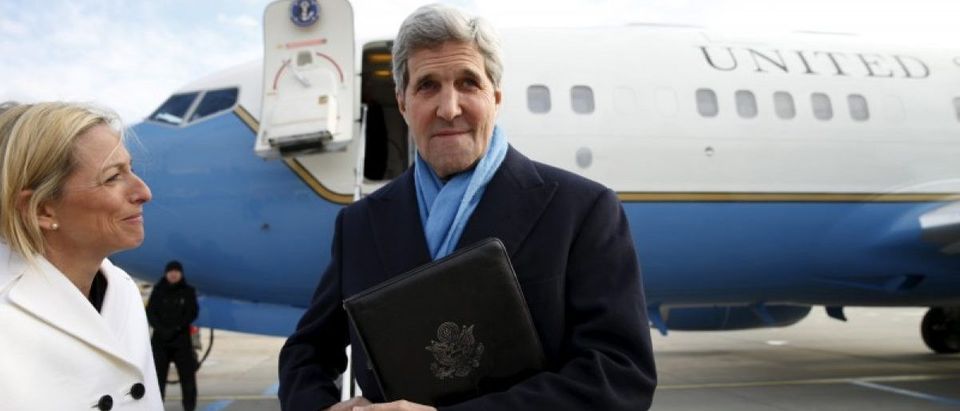 U.S. Secretary of State John Kerry is greeted by the US Ambassador to Austria Alexa Wesner as he steps from his plane upon arriving in Vienna