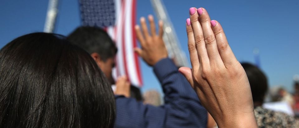 One hundred immigrants become American citizens during a naturalization ceremony at Liberty State Park on September 17, 2015 in Jersey City, New Jersey. (John Moore/Getty Images)