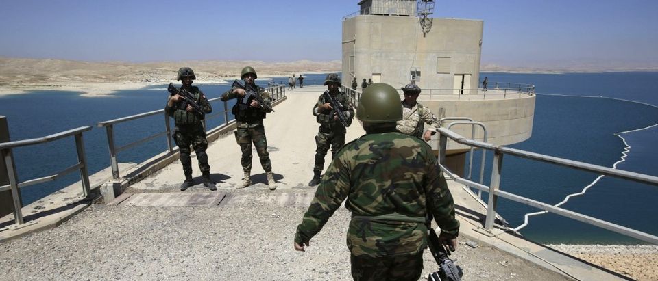 Peshmerga fighters stand guard at Mosul Dam in northern Iraq