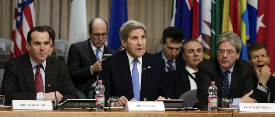 U.S. Secretary of State John Kerry talks next to Italian Foreign Minister Paolo Gentiloni and U.S. envoy to the coalition against Islamic State, Brett McGurk during a ministerial meeting regarding the Islamic State group in Rome
