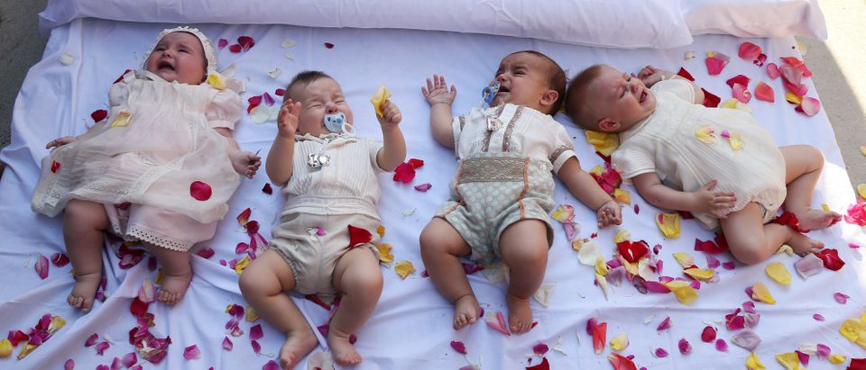 Babies react as they lie on a mattress in a street during 'El Colacho', the 'baby jumping festival' in the village of Castrillo de Murcia, near Burgos on June 7, 2015. Baby jumping (El Colacho) is a traditional Spanish practice dating back to 1620 that takes place annually to celebrate the Catholic feast of Corpus Christi. During the act - known as El Salto del Colacho (the devil's jump) or simply El Colacho - men dressed as the Devil jump over babies born in the last twelve months of the year who lie on mattresses in the street. CESAR MANSO/AFP/Getty Images)