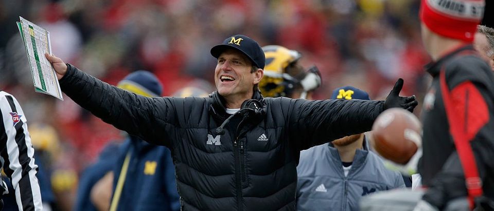 Head coach Jim Harbaugh of the Michigan Wolverines reacts to a roughing the kicker call against his team during the first quarter against the Ohio State Buckeyes at Michigan Stadium on Nov. 28, 2015 in Ann Arbor