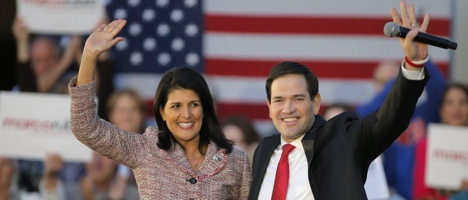South Carolina Governor Nikki Haley (L) and U.S. Republican presidential candidate Marco Rubio react on stage during a campaign event in Chapin, South Carolina February 17, 2016. Haley announced her endorsement of Rubio for the Republican presidential nomination. (REUTERS/Chris Keane)