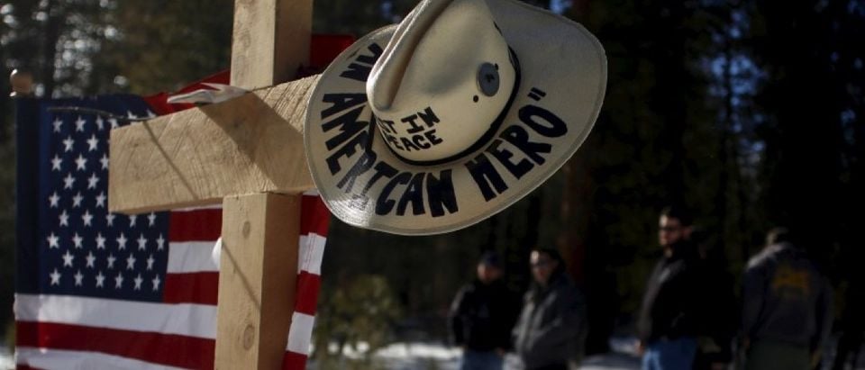 Members of the Pacific Patriots Network visit a memorial for Robert 'LaVoy' Finicum where he was shot and killed by law enforcement on a highway north of Burns, Oregon January 31, 2016. REUTERS/Jim Urquhart