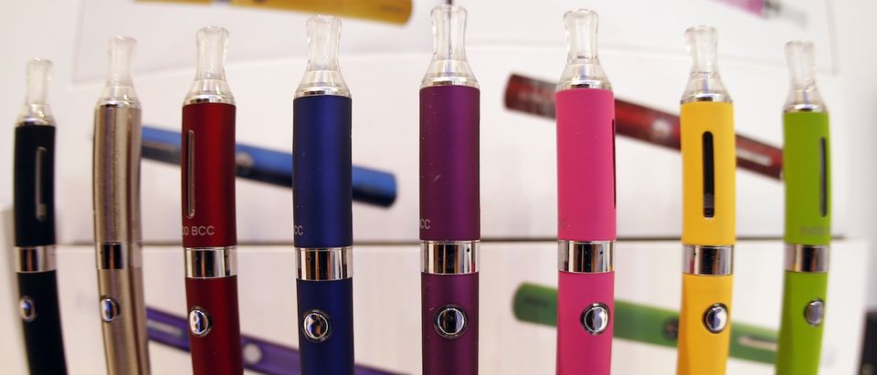 A window display with different colour models electronic cigarettes is seen in a shop in Paris October 8, 2013. The European Parliament voted on Tuesday to water down proposed tobacco legislation, rejecting an immediate ban on menthol cigarettes and scaling down the size of health warnings on packets following intense lobbying by tobacco companies. The parliament also said manufacturers should be free to sell smokeless e-cigarettes, which deliver nicotine electronically and are a rapidly growing market, as a consumer product when not being marketed as an aide to help people quit smoking. REUTERS/Charles Platiau