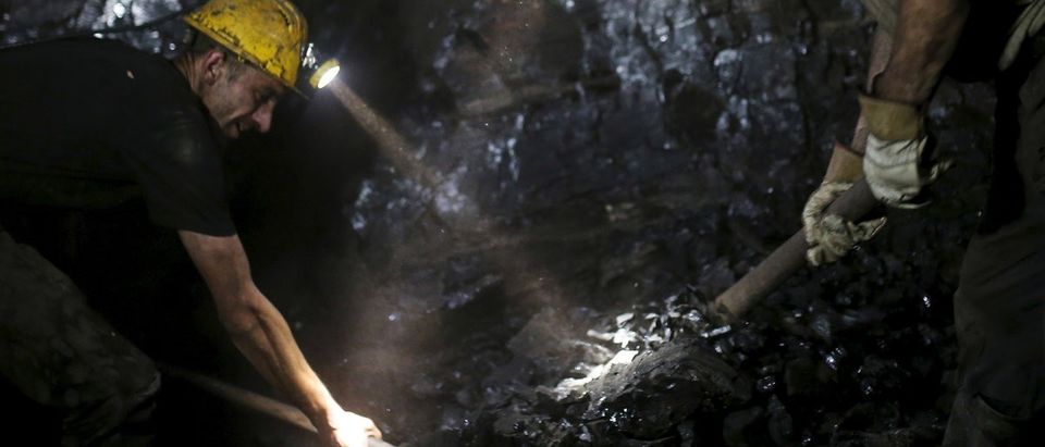 Miners work inside the Stara Jama coal mine, in Zenica