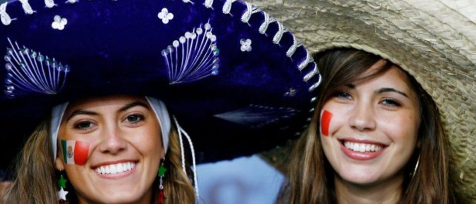 Women in large sombreros (Getty Images/Clive Mason)