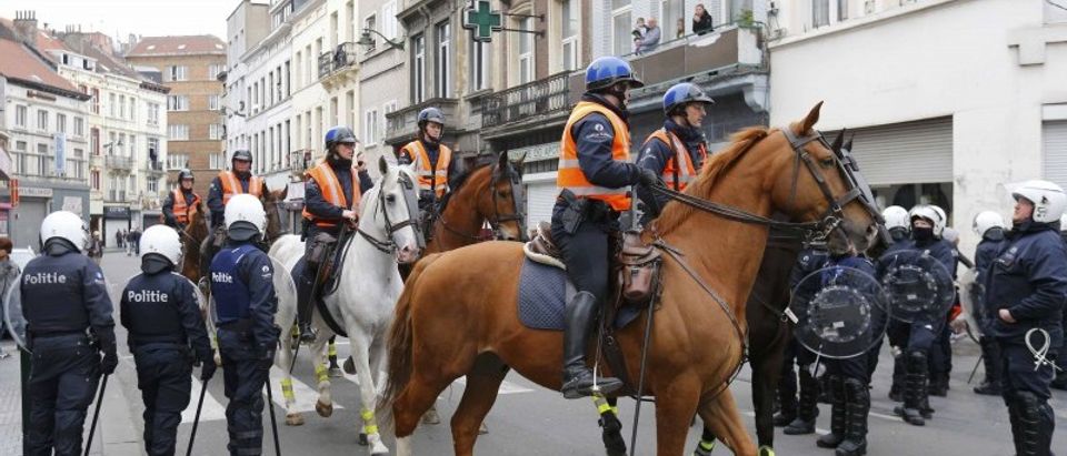 Mounted Belgian police take position in the Brussels district of Molenbeek