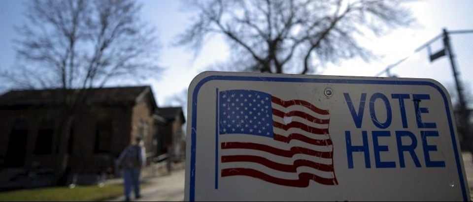 A voter arrives to cast their ballot in the Wisconsin presidential primary election at a voting station in Milwaukee