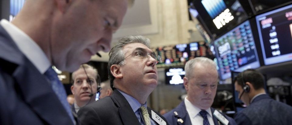 Traders work on the floor of the NYSE