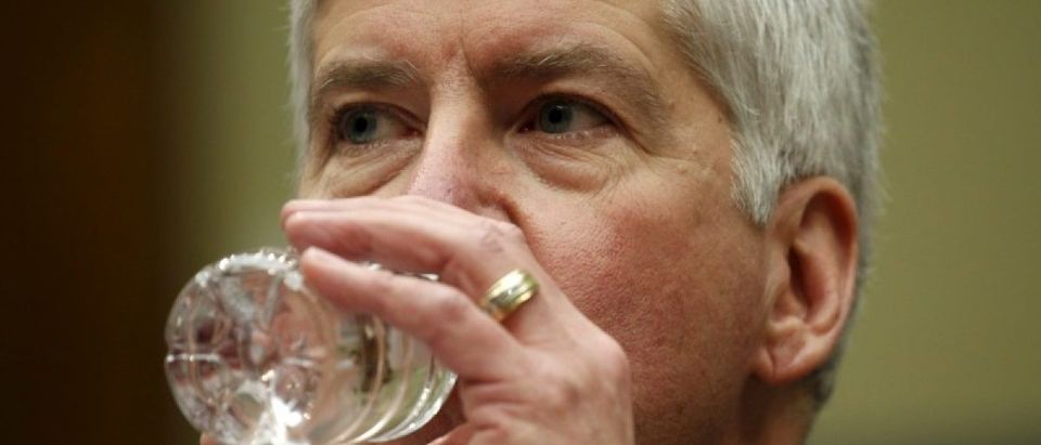 Michigan Governor Rick Snyder drinks some water as he testifies before a House Oversight and government Reform hearing on "Examining Federal Administration of the Safe Drinking Water Act in Flint, Michigan, Part III" on Capitol Hill in Washington March 17, 2016. REUTERS/Kevin Lamarque