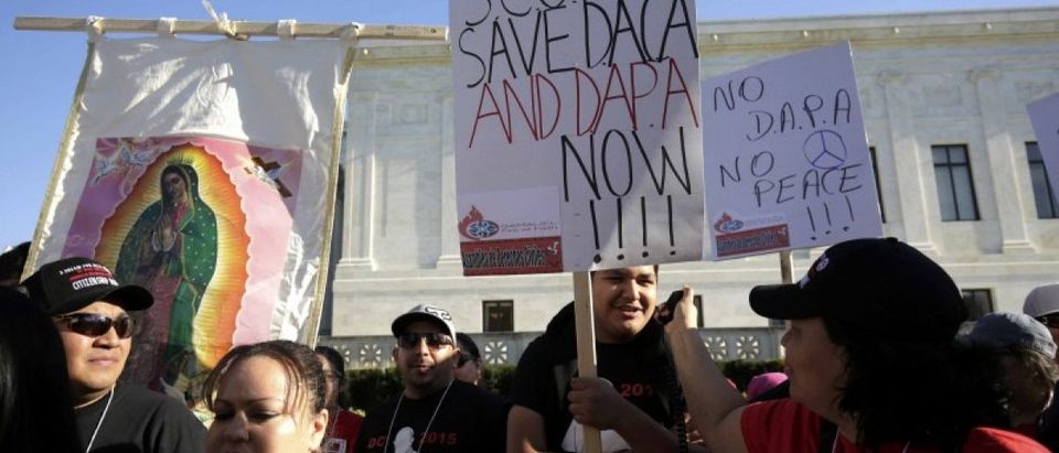 Immigration activists rally outside the U.S. Supreme Court in Washington
