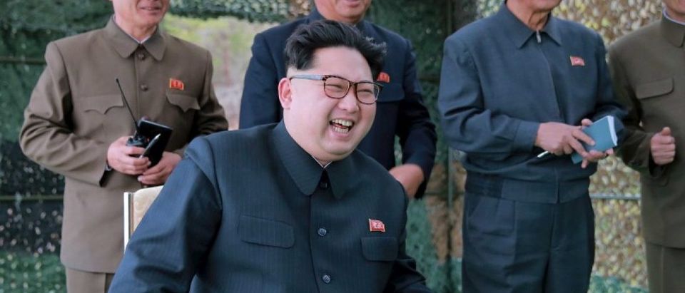 North Korean leader Kim Jong Un guides on the spot the underwater test-fire of strategic submarine ballistic missile